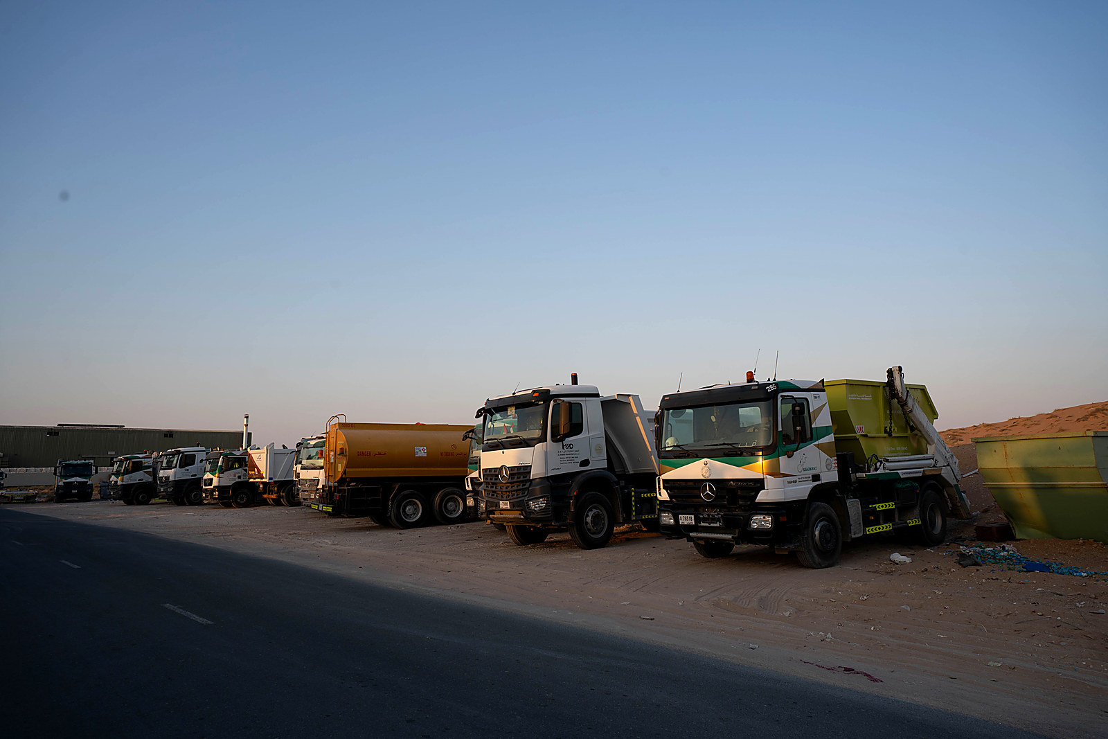 Al Mabar tipper trucks lined up at the Umm Al Quwain yard