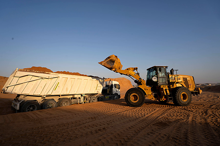 Loader and tipper working together